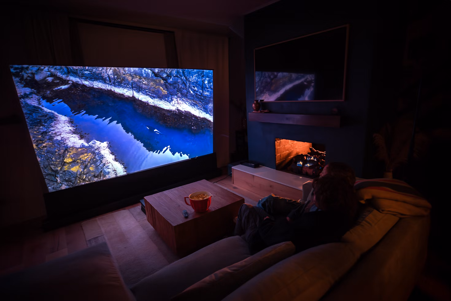 a home theater with a large projector on the wall