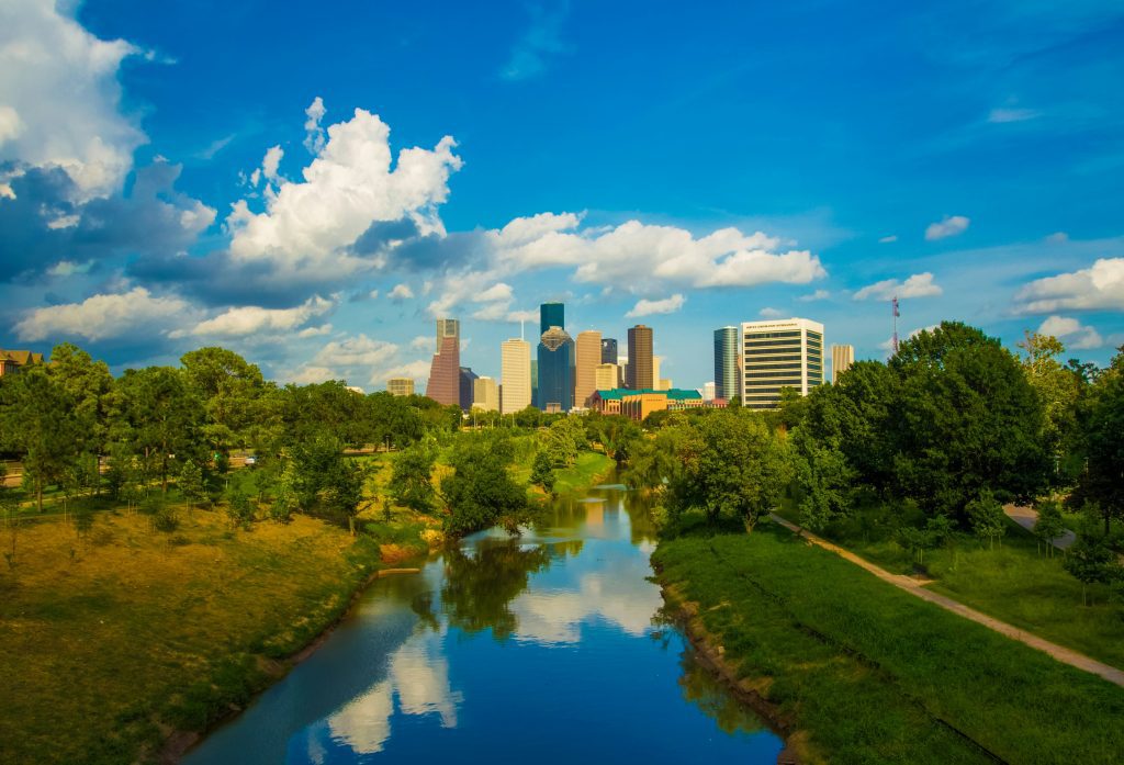 Houston Texas skyline with trees and waterway