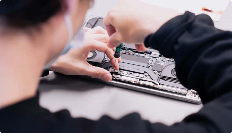 close up shot of technician repairing computer