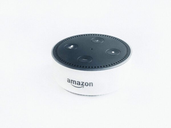 a white Amazon Alexa device against a white background.