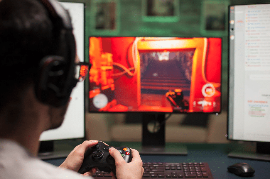 man playing video game on pc