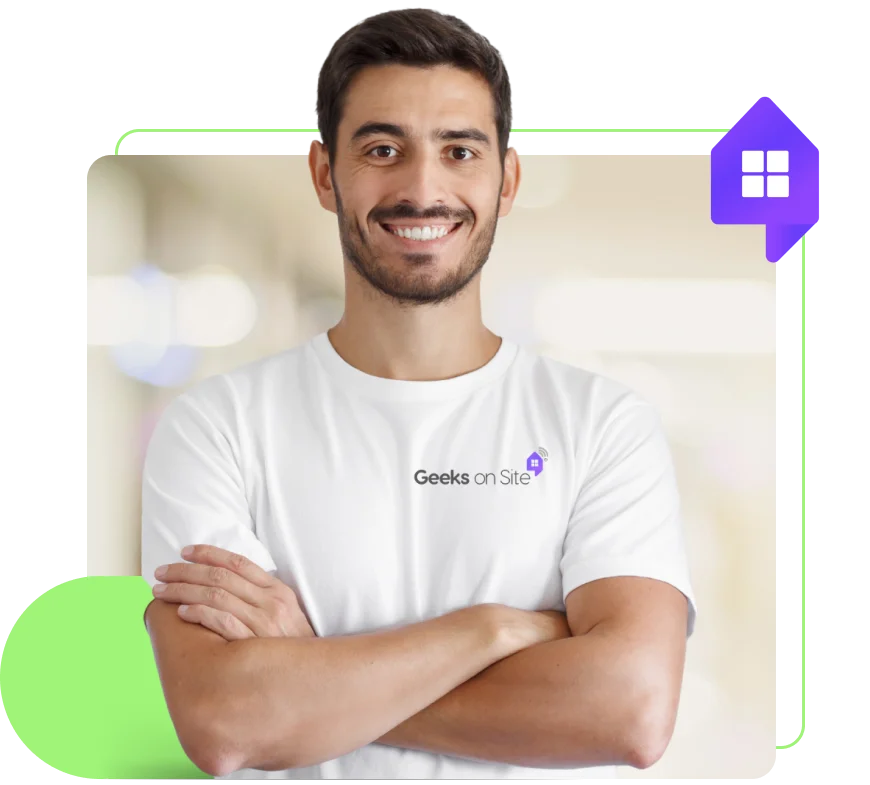 a geeks on site employee smiling with folded arms