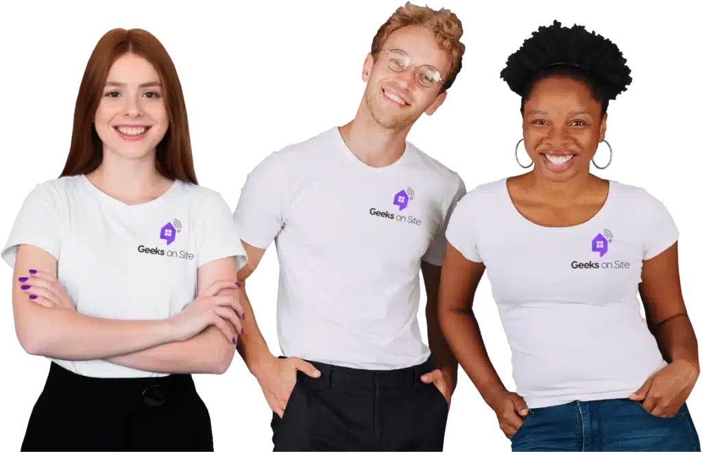 three Geeks on Site employees in white shirts with the company’s logo.